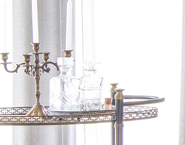 An image displaying a sophisticated and elegant tray, carefully placed in a newly built home by Uniform Developments in Ottawa. On the tray rests a pristine glass, symbolizing the luxurious and refined lifestyle offered in these homes. The setting reflects the attention to detail and high-end living standards in Uniform Developments' properties.
