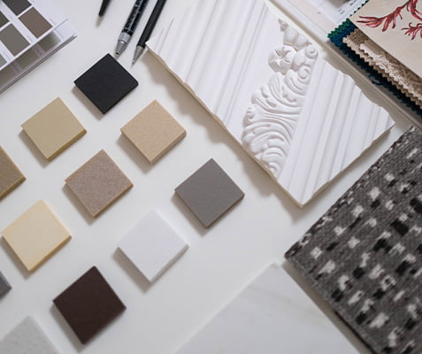 Color and material samples arrayed by Uniform Developments for home buyers in Ottawa, showcasing customizable design options. The image features a diverse selection of swatches in various colors and textures, illustrating the personalized design process offered by Uniform Developments for their new homes.